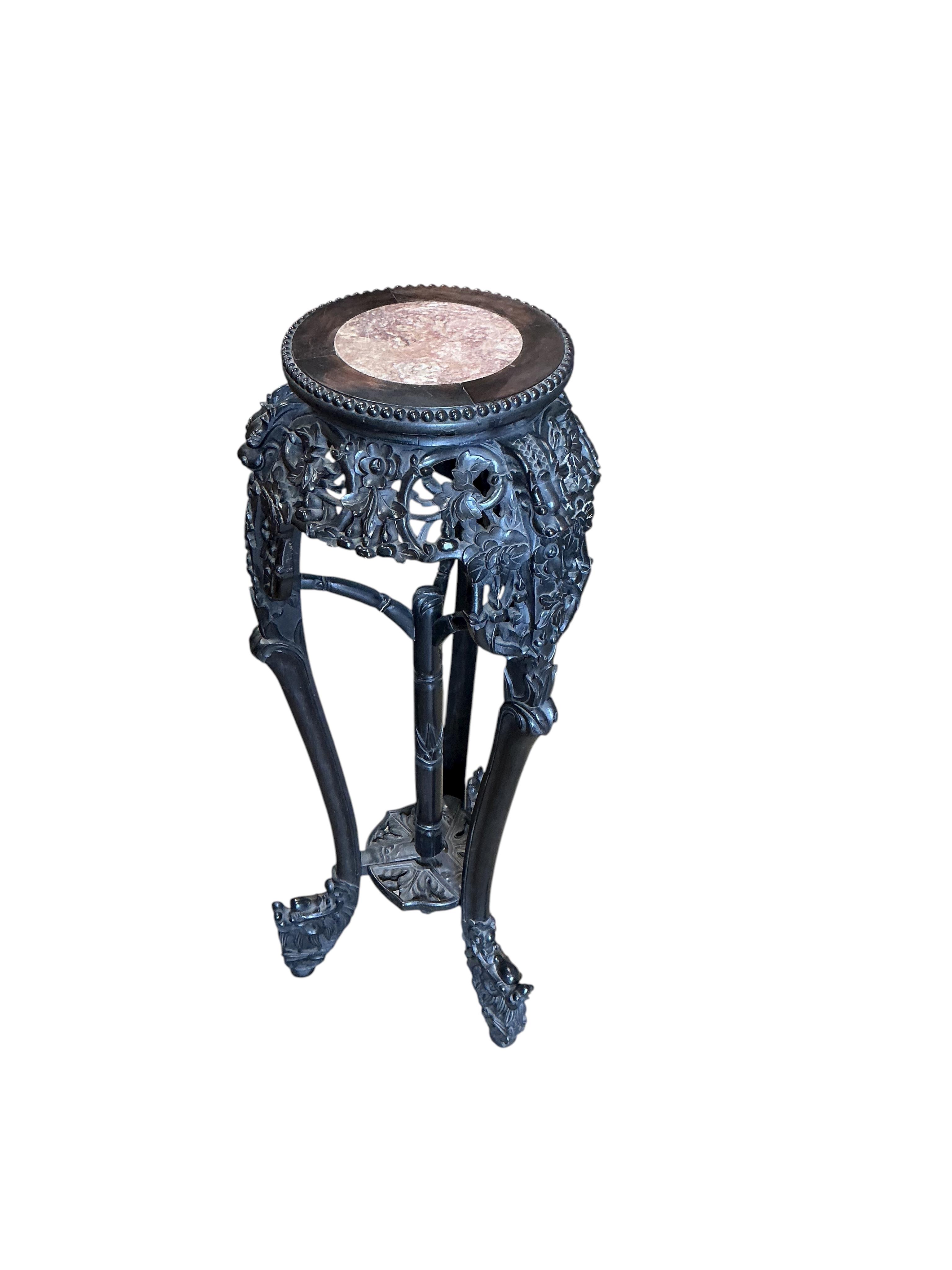 A Chinese marble topped vase stand, diameter 34cm, height 94cm